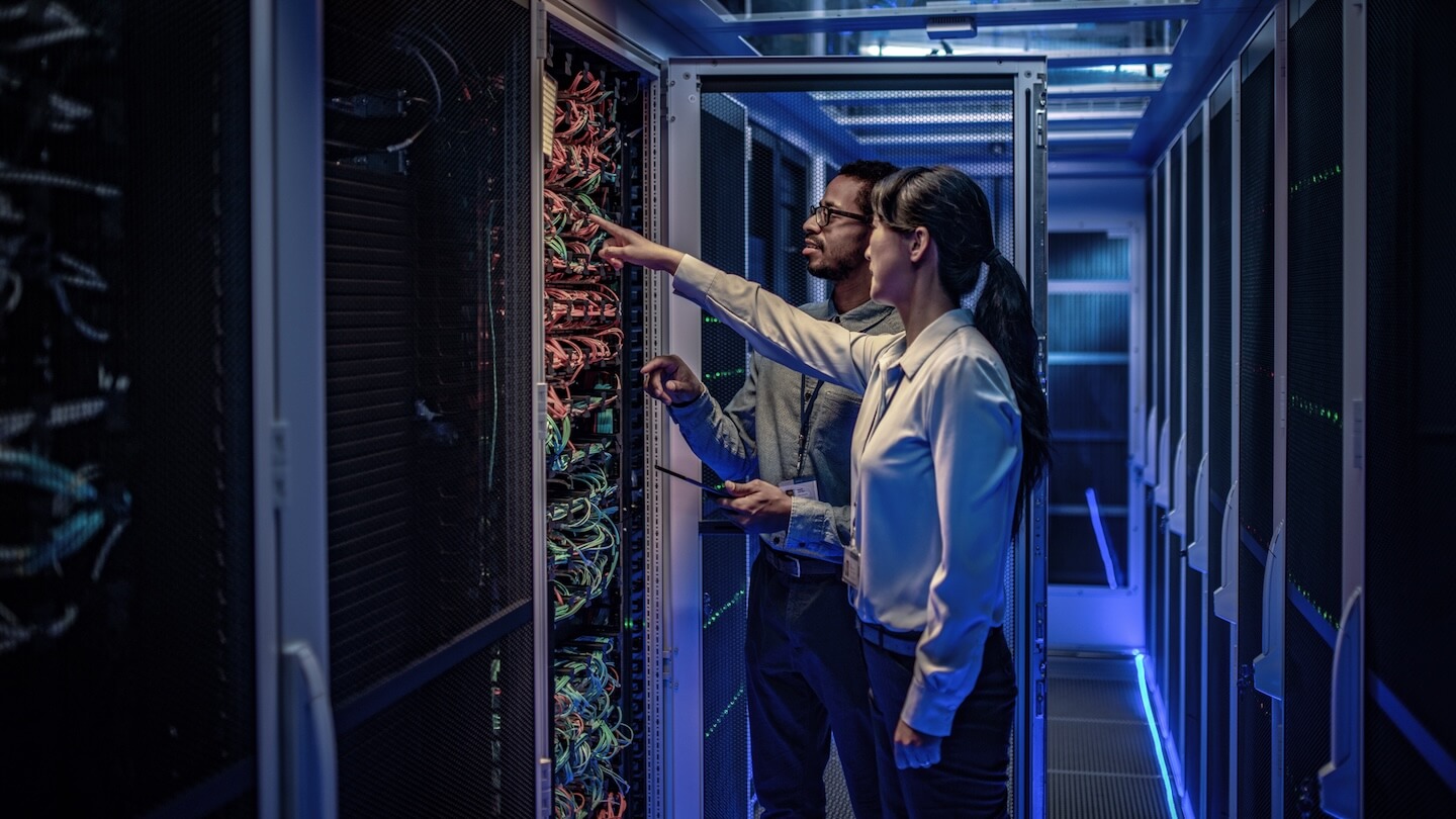 Engineers inspecting leased data center equipment